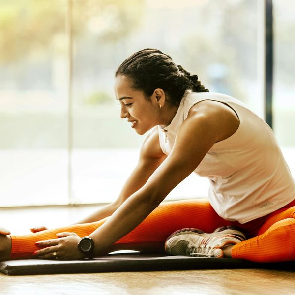 A person maintaining a difficult balance pose in yoga, showing focus.